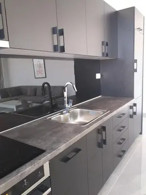 a kitchen with a sink and a counter top at Lunde Sea View Apartment in Rafailovici