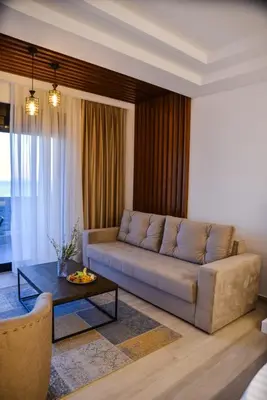 a living room with a couch and a table at Pino Boutique Hotel in Ulcinj