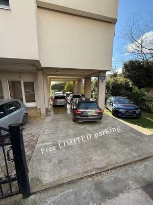 a group of cars parked in a parking lot at Residence Bella in Budva