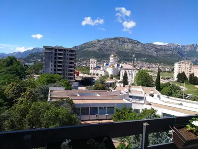 a view of a city with mountains in the background at Apartman Ivona in Bar