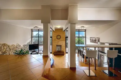 a large living room with a table and chairs at Villa Milana Budva in Budva