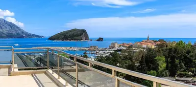 a view of a city and the ocean at Gufo Apart in Budva