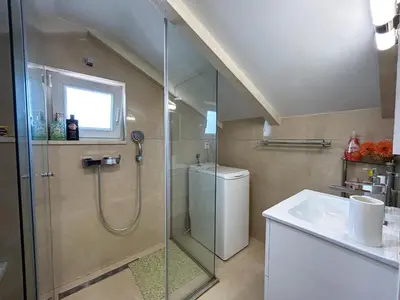 a bathroom with a shower and a sink at Palma Apartments in Kotor