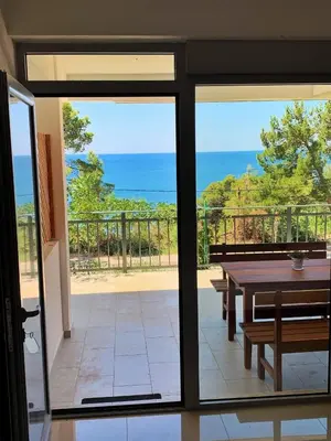 a view of the ocean from a patio with a table at Apartment kalina in Bar