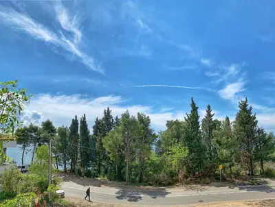 a person walking down a street in a park at Apartment kalina in Bar
