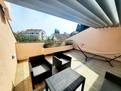 a view of a balcony with chairs and tables at Montenegro Sea Pearl Apartments Petrovac in Petrovac na Moru
