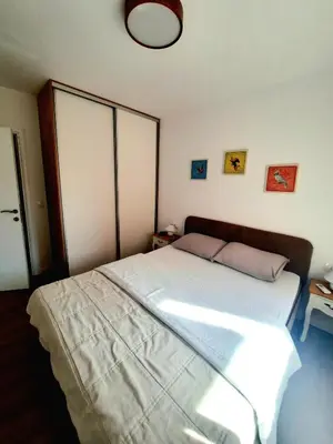 a bedroom with a large white bed in it at Montenegro Sea Pearl Apartments Petrovac in Petrovac na Moru