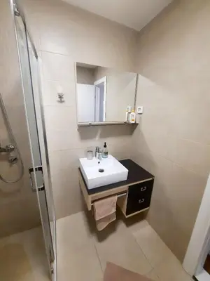 a bathroom with a sink and a shower at Montenegro Sea Pearl Apartments Petrovac in Petrovac na Moru