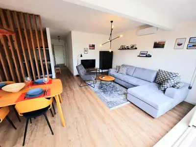 a living room with a couch and a table at Montenegro Sea Pearl Apartments Petrovac in Petrovac na Moru