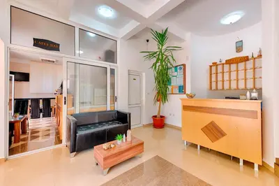 a living room with a couch and a table at HOTEL DANA in Čanj