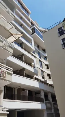 an apartment building with balconies on the side of it at Lux Apartment Vidovic II in Rafailovici