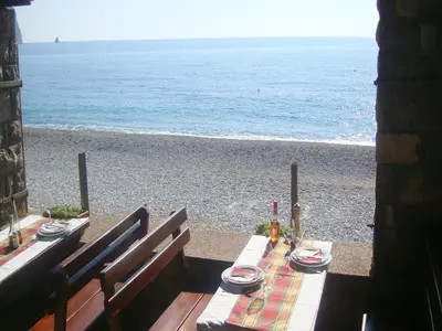 a table with a view of the beach at Apartments Galija in Petrovac na Moru