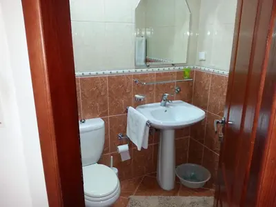 a bathroom with a toilet and a sink at Apartments Stevo Nikočević in Bar