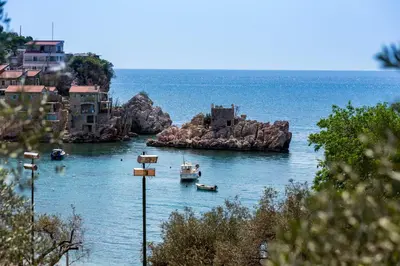 a view of a harbor with boats in the water at Mali Miločer Bay Accommodation in Sveti Stefan