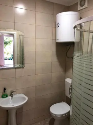 a bathroom with a toilet and a sink at Apartmani Sunce in Bar