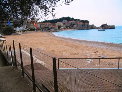 a view of a beach with houses and the ocean at Apartments Villa Pržno in Sveti Stefan