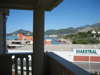 a view of a body of water from a balcony at Apartments Villa Pržno in Sveti Stefan