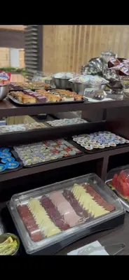 a buffet of different types of cakes and pastries at Apart Lux Beciragic in Dobra Voda