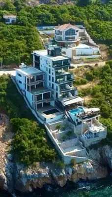 an aerial view of a building on a cliff at Apart Lux Beciragic in Dobra Voda
