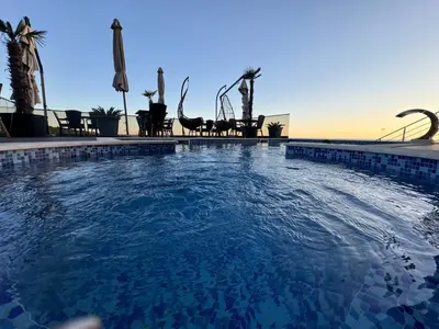a large swimming pool with a water slide at Apart Lux Beciragic in Dobra Voda