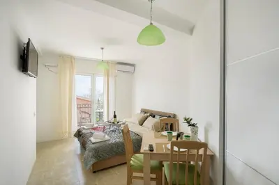 a living room with a couch and a table at Apartments Natali in Bar