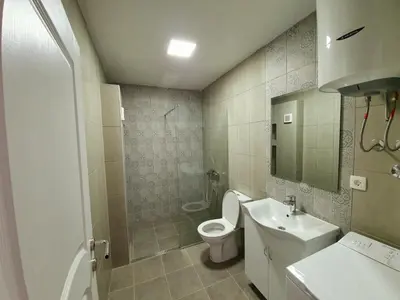 a bathroom with a toilet and a sink at Apartments Kingfisher in Virpazar