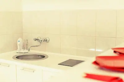 a bathroom with a sink and a bath tub at Kotor Sunrise Apartments in Kotor
