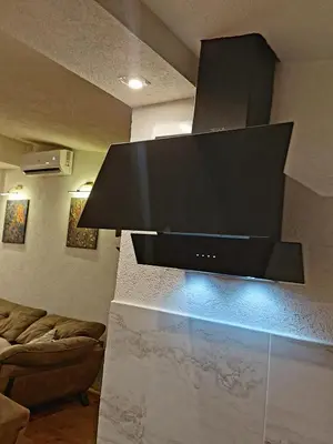 a large flat screen tv on a wall in a living room at Apartmani vuk in Cetinje