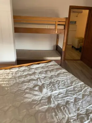 a bed in a room with a bunk bed at Jednosoban stan Lucija in Bar