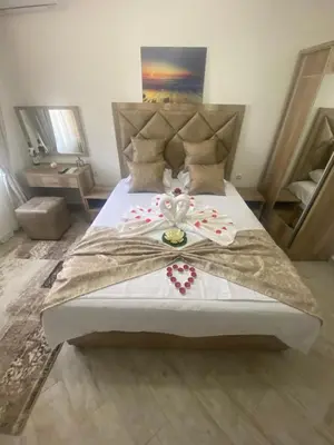 a bedroom with a large bed with hearts on it at Apartments Gusar in Ulcinj