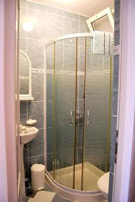 a bathroom with a shower and a sink at Omega Apartments in Ulcinj