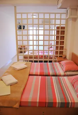 a room with two beds in a room at Omega Apartments in Ulcinj