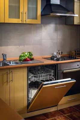 a kitchen with a dishwasher and a sink with a dishwasher at Old Town Experience Apartment in Kotor