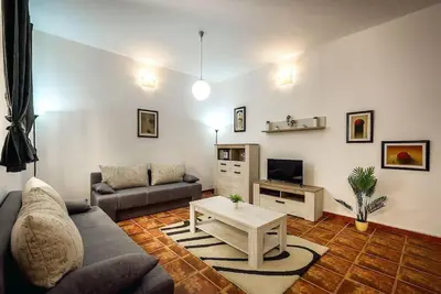 a living room with a couch and a coffee table at Old Town Experience Apartment in Kotor