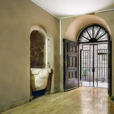 an empty room with a door and a window at Old Town Experience Apartment in Kotor