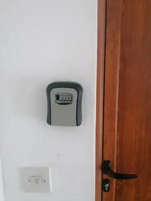 a digital clock on a wall next to a door at Apartment Adriatic - Budva in Budva