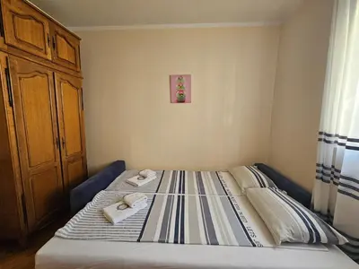 a bed with towels on it in a bedroom at Apartment Adriatic - Budva in Budva