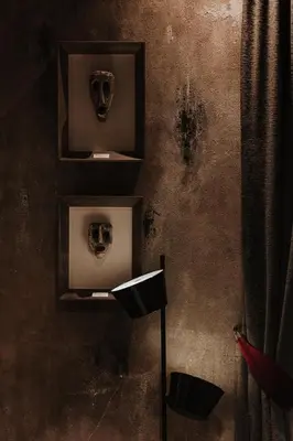 a room with two skulls on the wall at Boscovich Boutique Hotel in Podgorica