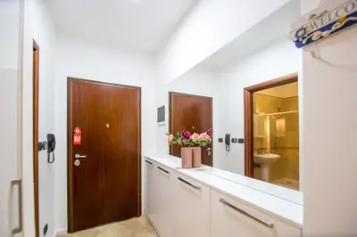 a bathroom with a sink and a mirror at Apartment Studio Premier in Rafailovici