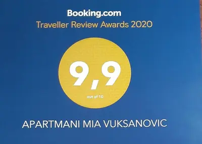 a poster for a travel review awards with a yellow circle at APARTMANI MIA VUKSANOVIC in Cetinje