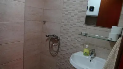 a bathroom with a shower and a sink at APARTMANI MIA VUKSANOVIC in Cetinje