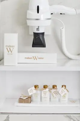 a mixer on a shelf with gold engagement rings at MAISON W in Kotor