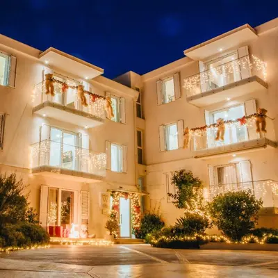 a facade of a building with christmas lights at MAISON W in Kotor