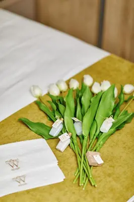 a bunch of green flowers on a table at MAISON W in Kotor