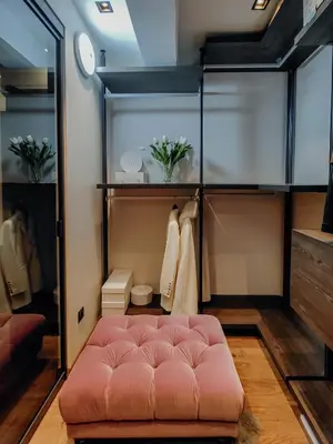 a room with a pink ottoman in a closet at MAISON W in Kotor