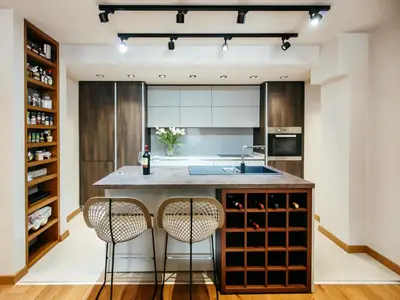a kitchen with a large island with two bar stools at MAISON W in Kotor