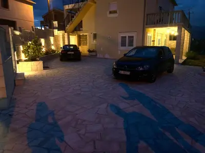a shadow of two cars parked in a driveway at Vila Jovanka in Tivat