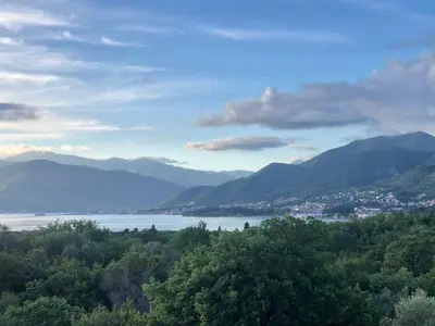 a view of a lake and mountains in the distance at Vila Jovanka in Tivat