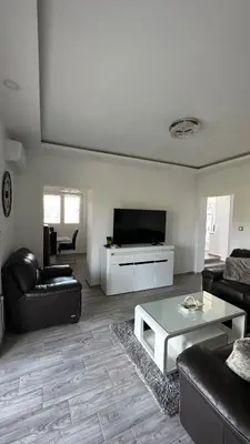 a living room with a couch and a coffee table at Vila Jovanka in Tivat