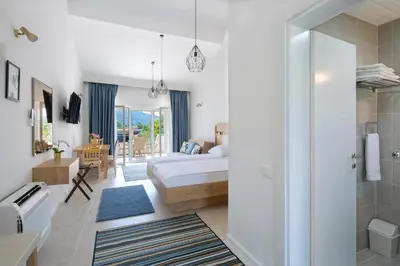 a bedroom with a bed and a bathroom at Luxurious Apartments Aria in Budva